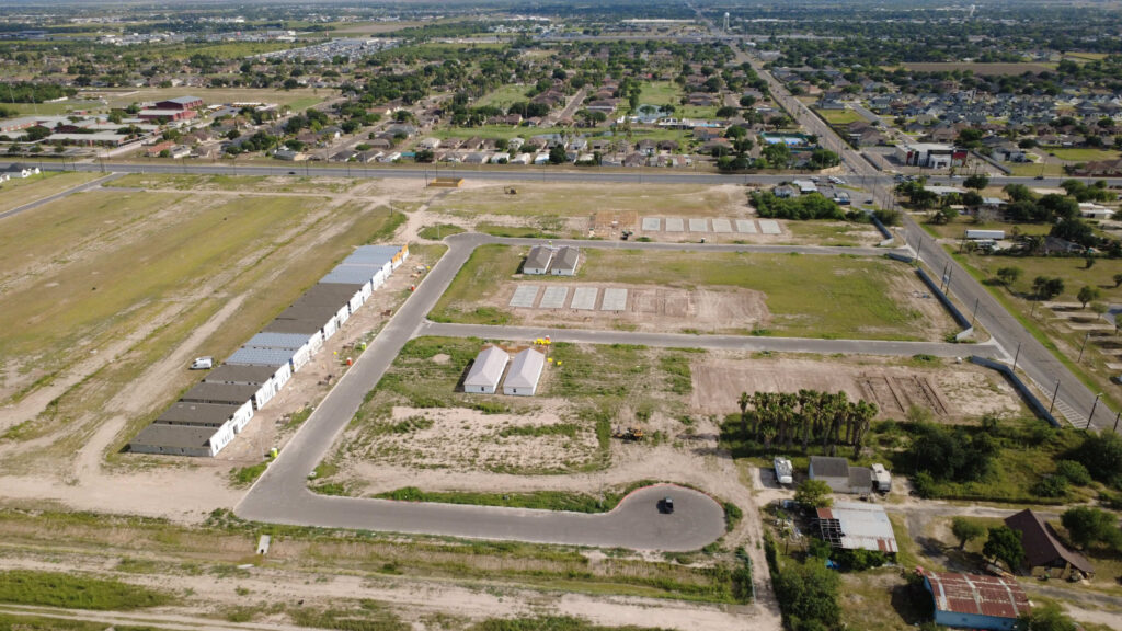 aerial view homes and land in the riverside tower fourplex homes in alamo, texas