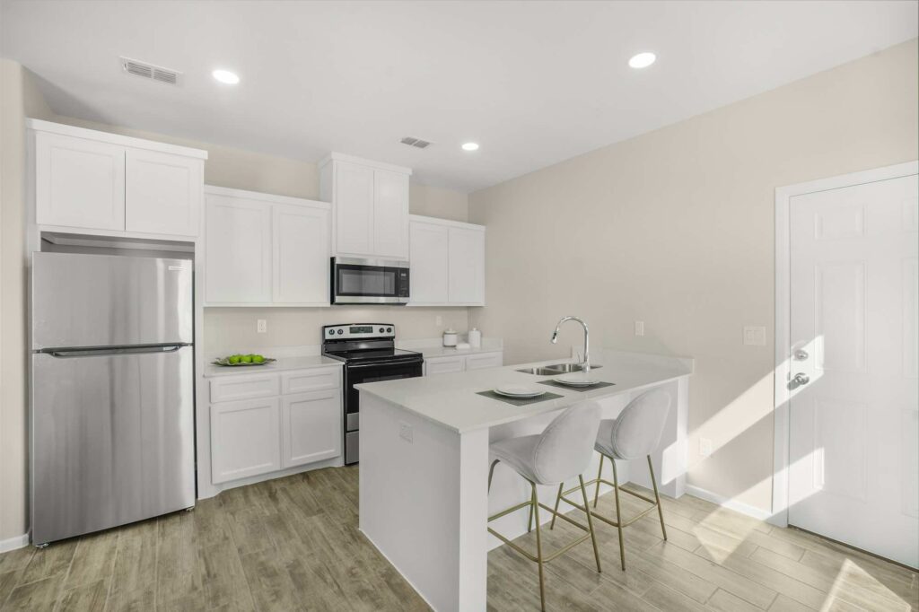 Full view of kitchen, island, and appliances