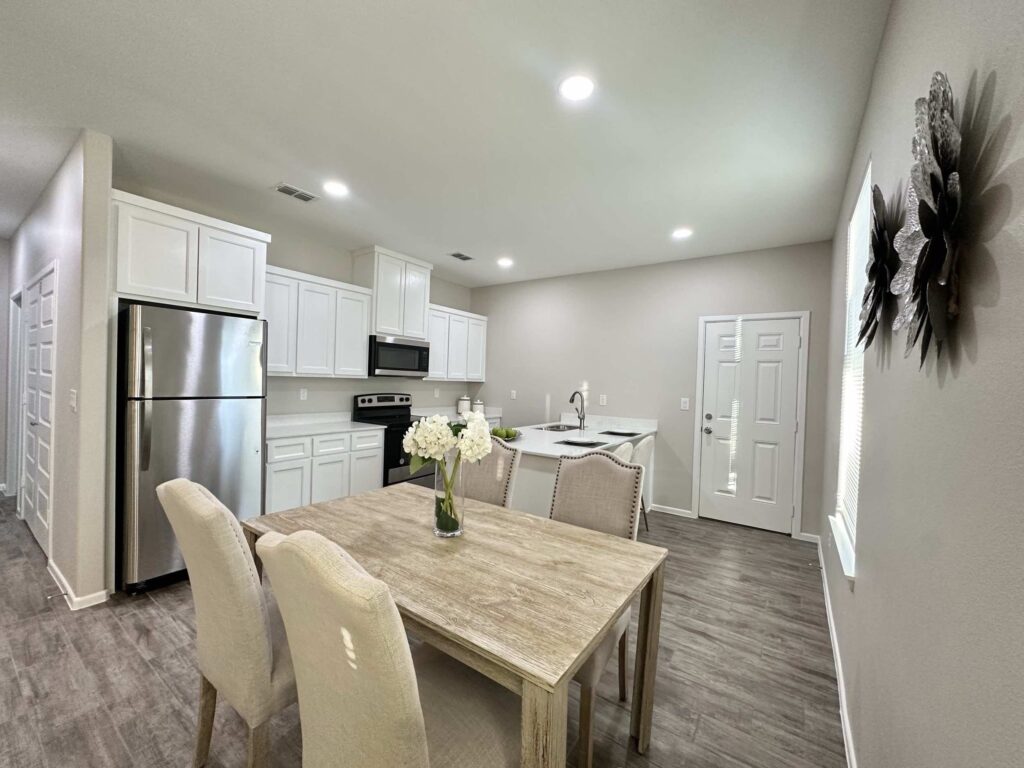 View of dining room and kitchen in the Dawson Estates Fourplex in Mercedes Texas