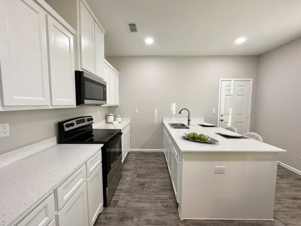View of kitchen and island in the Dawson Estates Fourplex in Mercedes Texas