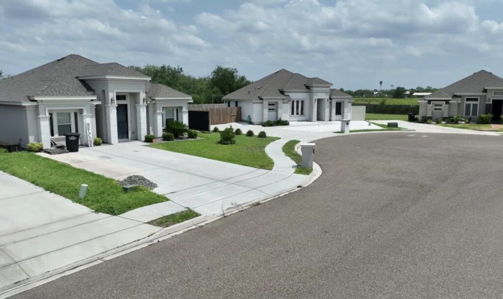 View of three homes in a cul-de-sac in the Comarex Subdivision in Alton, Texas